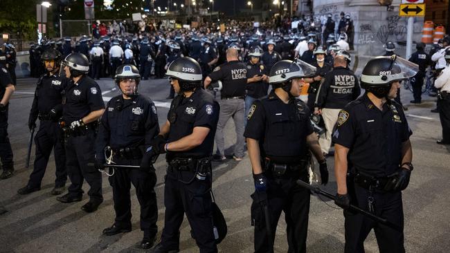 China is watching: New York police block protesters crossing the Manhattan Bridge from entering Manhattan on Tuesday night. Picture: AP