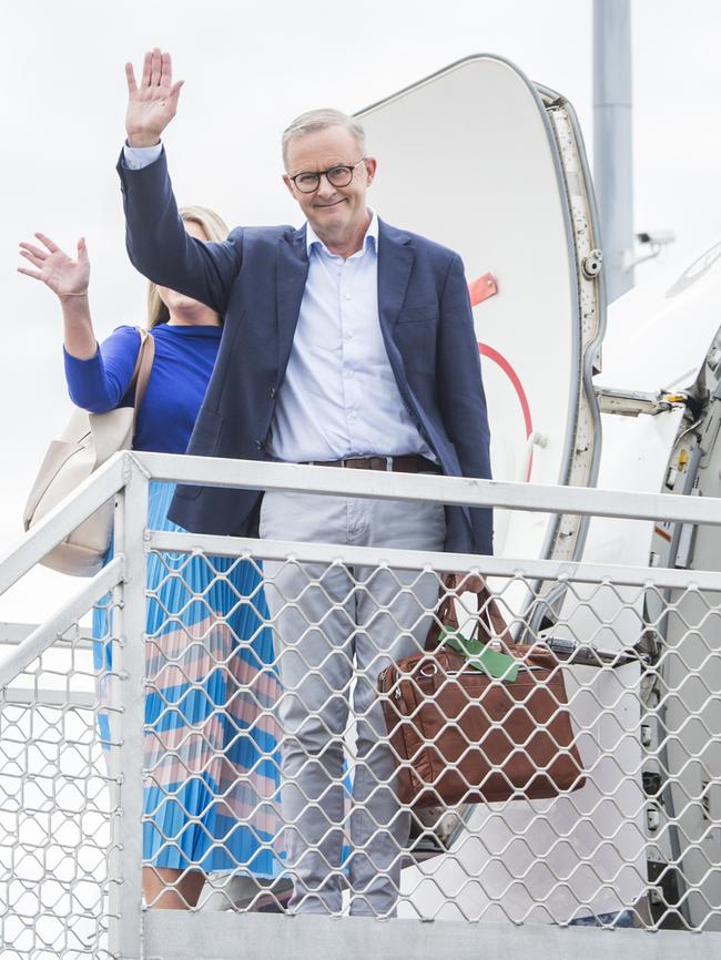 Anthony Albanese waves as he boards a flight from Sydney. Picture: Steven Siewert