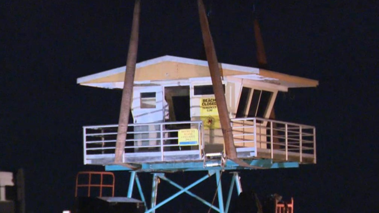 The North Cronulla Surf Club Tower has been removed after teetering on the edge of a steep fall due to erosion of the beach in heavy surf. Picture: 7News