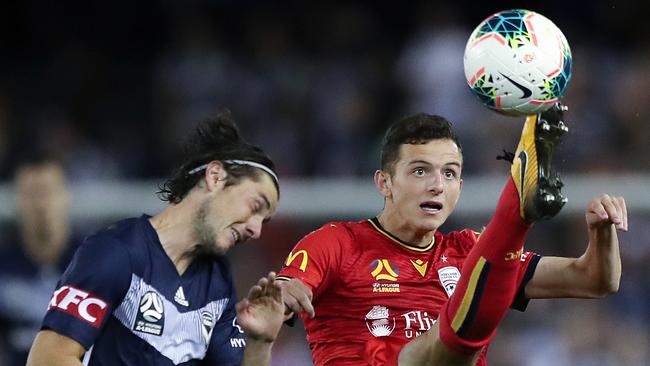 Melbourne Victory’s Marco Rojas and Adelaide United’s Louis D’Arrigo at Marvel Stadium in Melbourne. Picture: AAP Image/George Salpigtidis