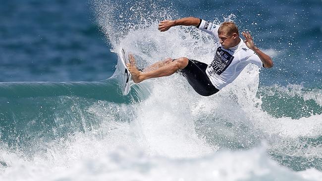  Surfing world champion Mick Fanning enjoys the waves at nearby break Duranbah recently.