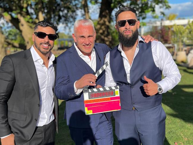 Auctioneer Tom Panos with the winning team of Oz and Omar on the 2022 season of The Block. NSW real estate. Picture: Supplied.