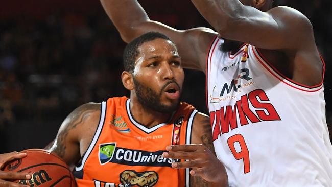 CAIRNS, AUSTRALIA — OCTOBER 21: DJ Newbill of the Taipans drives to the basket past Cedric Jackson of the Hawks during the round two NBL match between the Cairns Taipans and the Illawarra Hawks at Cairns Convention Centre on October 21, 2018 in Cairns, Australia. (Photo by Ian Hitchcock/Getty Images)