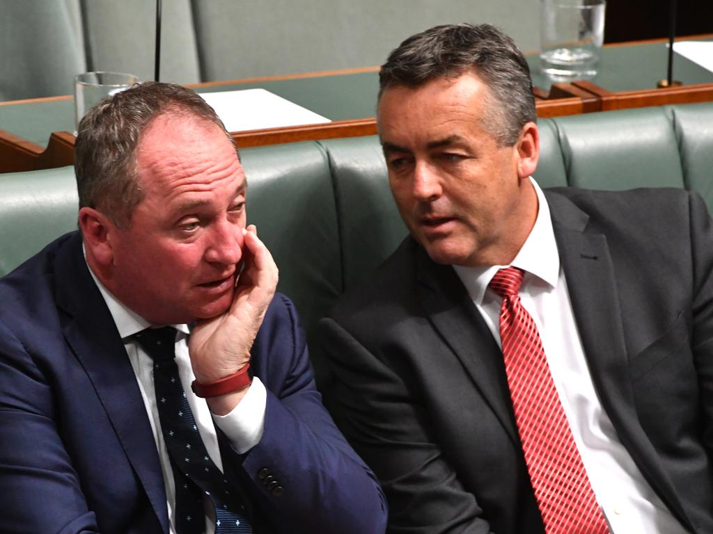 Barnaby Joyce and Darren Chester locked in conversation in the parliament. Picture: AAP Image/Mick Tsikas