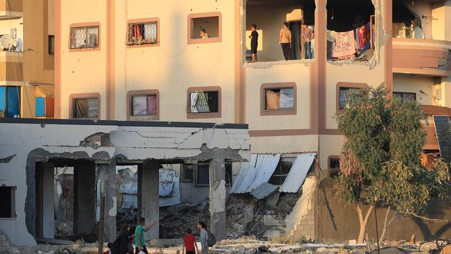 Displaced Palestinians gather in a damaged building in which they took refuge in al-Bureij refugee camp in the central Gaza Strip. Picture: AFP