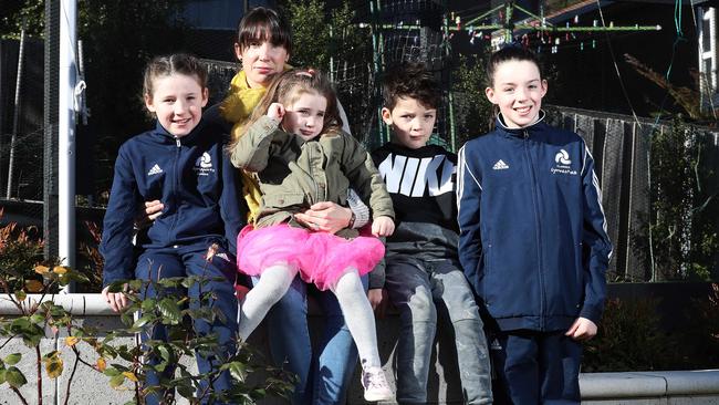 Victoria Brumby with her children Lottie, 9, left, Loulou, 4, Angus, 7, and Tilly, 11, who she will have immunised against the meningococcal outbreak at a cost of $1110. Picture: LUKE BOWDEN