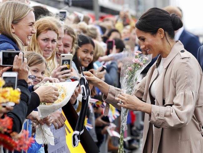 The Duchess of Sussex, shown during a walkabout at the Viaduct in Auckland, made fans everywhere she went. Picture: Getty