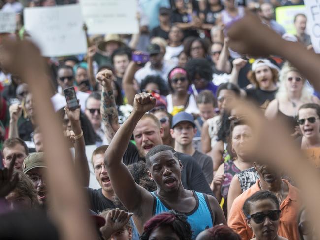 Protesters march at a Black Lives Matter demonstration in Cincinnati on Sunday. Picture: John Minchillo