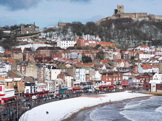 Snow covers the beach in the sea side resort of Scarborough in North Yorkshire on February 27, 2018. A blast of Siberian weather sent temperatures plunging across much of Europe on Tuesday, causing headaches for travellers and leading to several deaths from exposure as snow carpeted palm-lined Mediterranean beaches. Picture: AFP