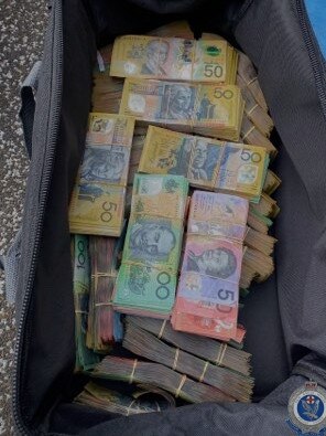 Strike Force Raptor officers seized more than $300k in cash. Picture: NSW Police