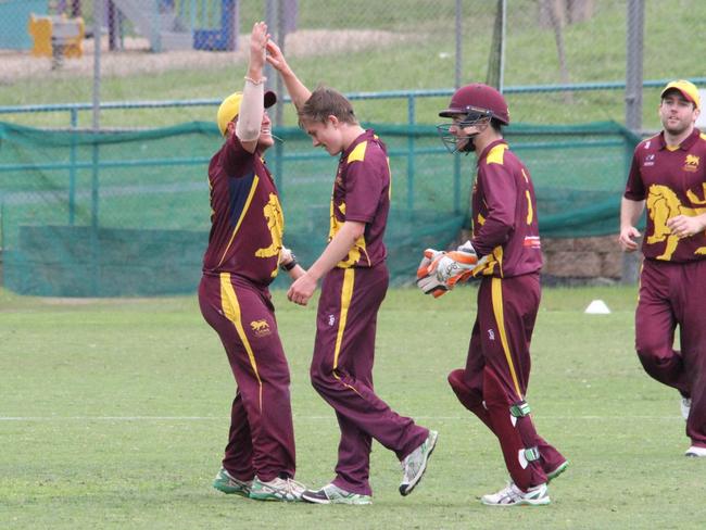 Bailen Clarke (second from left) celebrates a wicket for Fitzroy Doncaster in Premier Cricket.