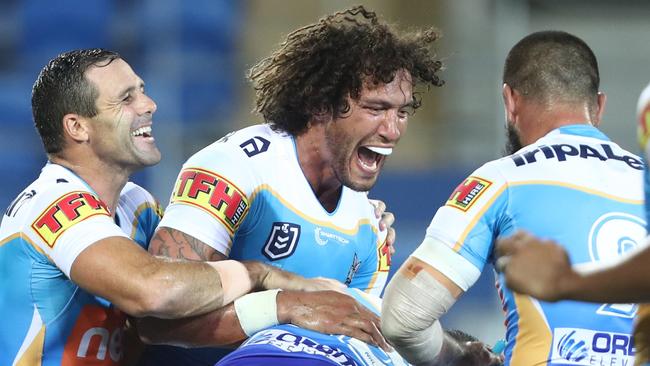 Kevin Proctor celebrates one of his two tries for the Titans against the Broncos. Picture: Getty Images