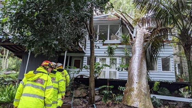 NSW Rural Fire Service volunteers from the Ingleside and Scotland Island brigades helped homeowners of a house on Scotland Island badly damaged by a fallen tree. Picture: Ingleside RFS