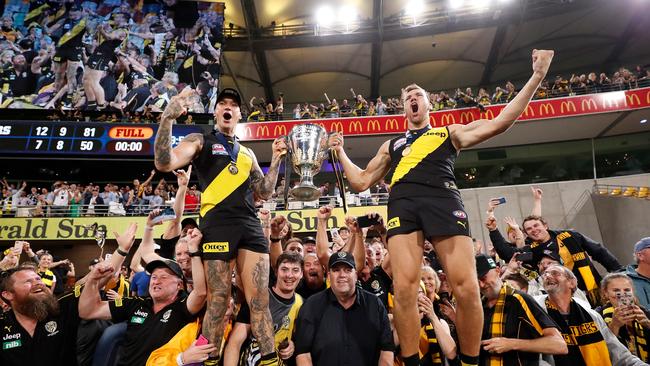 Dustin Martin (left) stole the show in Richmond’s Grand Final win at the Gabba. Picture: Michael Willson/AFL Photos via Getty Images