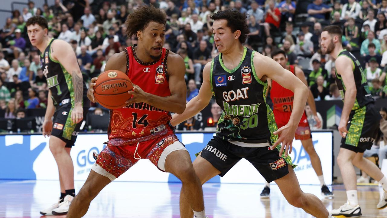 Owen Foxwell of the Phoenix defends Biwali Bayles of the Hawks during his side’s loss on Saturday night. Darrian Traynor/Getty Images)