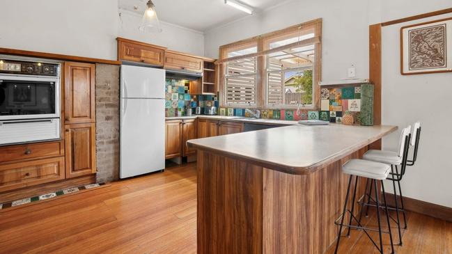 Solid timber floors flow throughout much of the house.