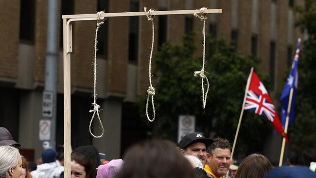 Gallows with nooses at a rally in Melbourne on Saturday. Picture: NCA NewsWire/Daniel Pockett