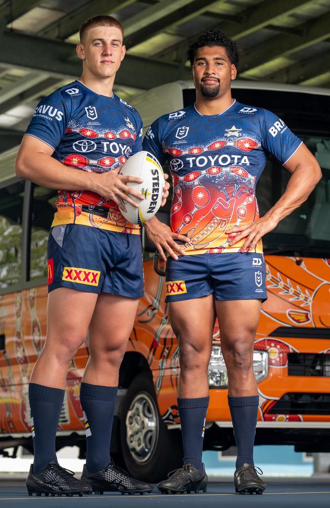 North Queensland Cowboys rugby league players Kaiden Lahrs and Jamal Shibasaki standing in front of a new ‘Nhinhinhi’-inspired Toyota Coaster. The 22-seat Coaster, donated by Toyota, provides daily transport for NRL Cowboys House boarding students. Picture: Supplied