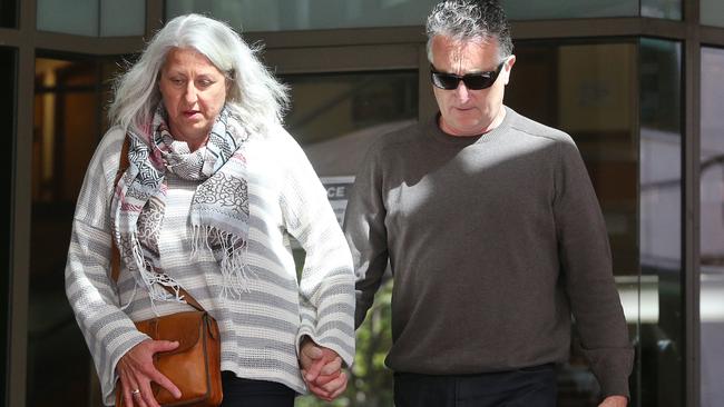 Jack Aston (right) leaves an earlier court hearing with his wife. Picture: Hamish Blair