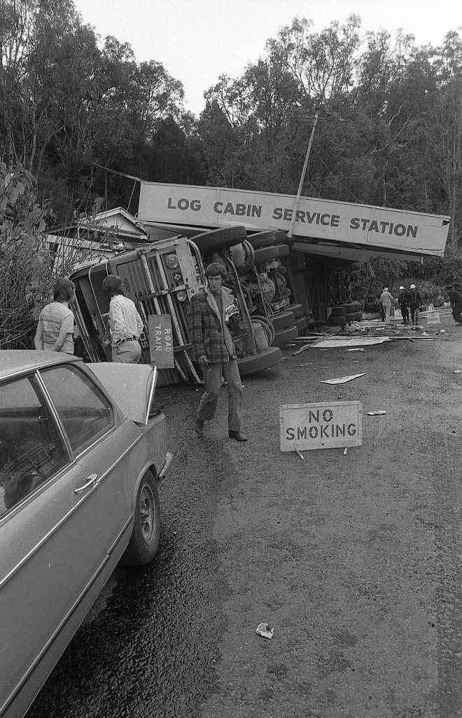 Historic: Toowooba: Accidents Semi-trailer crash at the Log Cabin Service Station on the Toowoomba Range in on 6th September,1978. Three men suffered minor injuries during the crash when the semi-trailer rolled taking out petrol bowsers. A car parked at the service station was also damaged. Photo: Bruce Mackenzie / The Chronicle Neg U869. Picture: Bruce Mackenzie