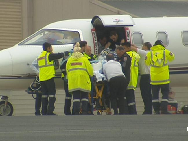 A survivor arrives at Essendon Airport in Melbourne via to be transported to the Alfred Hospital. Picture: Seven News