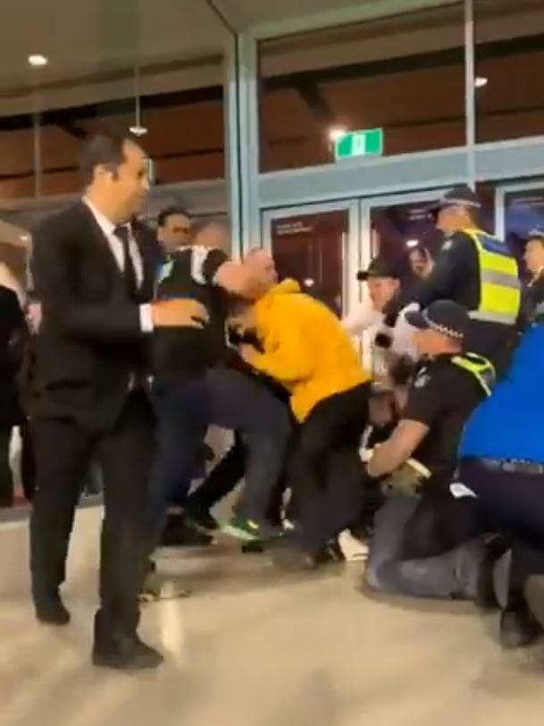 Footy fans clashing with police and security at last night's preliminary final. Picture: Twitter, @brushbrook.