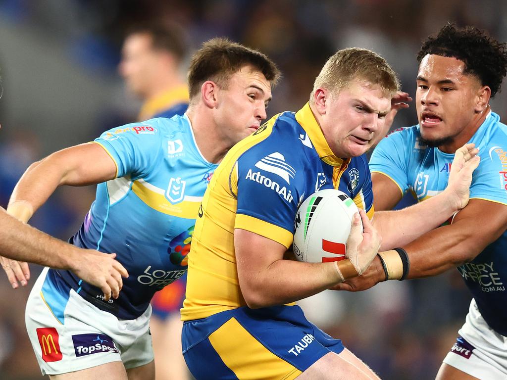 GOLD COAST, AUSTRALIA - JULY 13: Charlie Guymer of the Eels is tackled during the round 19 NRL match between Gold Coast Titans and Parramatta Eels at Cbus Super Stadium, on July 13, 2024, in Gold Coast, Australia. (Photo by Chris Hyde/Getty Images)