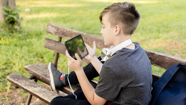 Jake can't get off his iPad. Picture: iStock