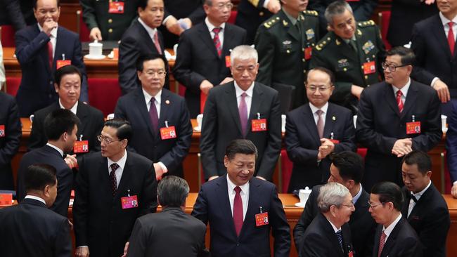 Chinese President Xi Jinping waves as he leaves after the closing of the 19th Communist Party Congress at the Great Hall of the People.