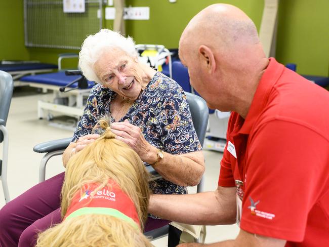 Mr Bojangles with owner Andrew Saran visiting stroke patient Valerie June Buckman. Picture: Darren Leigh Robert