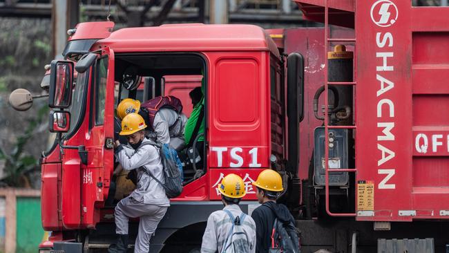 Employees in a truck at the Indonesia Morowali Industrial Park. Picture: Garry Lotulung.