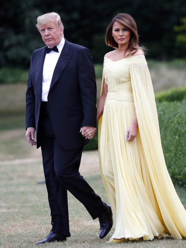 President Donald Trump and first lady Melania Trump leave Winfield House before boarding Marine One helicopter for the flight to nearby Blenheim Palace. Photo: AP