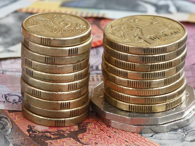 Australian coins set on a background of Australian notesTo see a range of Australian themed images please visit this lightbox, money generic