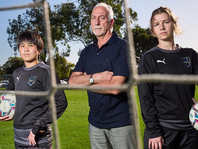 WNPL players, Yuka Sasaki with president, Jim Tsouvalas, and Izabel Czechowicz from the Adelaide Comets Football Club, where Adelaide City Council have knocked back a request for a 1.1m fence to be built, Wednesday, Feb. 14, 2024. Picture: Matt Loxton