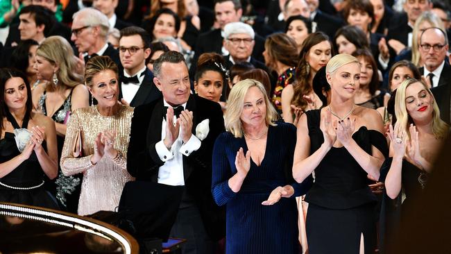 Penelope Cruz, Rita Wilson, Tom Hanks, Charlize Theron, and Margot Robbie stand in the front row during the 92nd Annual Academy Awards last month. Picture: Getty