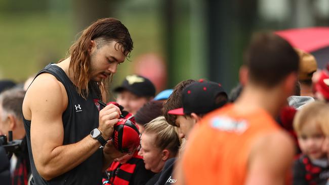 Sam Draper signs autographs for fans at training on Saturday. Picture: Graham Denholm/Getty Images