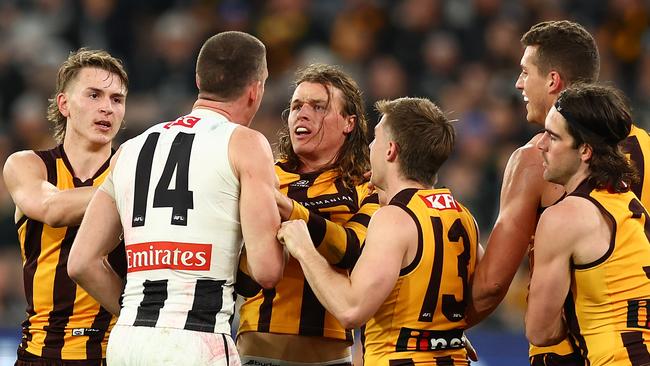 MELBOURNE, AUSTRALIA - JULY 20: Darcy Cameron of the Magpies and Jack Ginnivan of the Hawks have a disagreement during the round 19 AFL match between Hawthorn Hawks and Collingwood Magpies at Melbourne Cricket Ground on July 20, 2024 in Melbourne, Australia. (Photo by Graham Denholm/AFL Photos/via Getty Images)