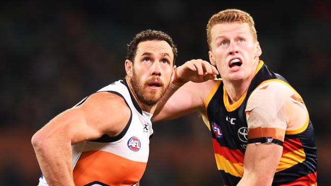 Shane Mumford of the Giants rucks against Reilly O'Brien of the Adelaide Crows during the round 12 AFL match at Adelaide Oval. Picture: Mark Brake/Getty Images