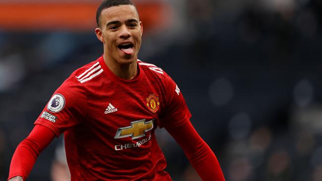 Manchester United's English striker Mason Greenwood reacts after scoring the team's third goal during the English Premier League football match between Tottenham Hotspur and Manchester United at Tottenham Hotspur Stadium in London, on April 11, 2021. (Photo by Adrian DENNIS / POOL / AFP) / RESTRICTED TO EDITORIAL USE. No use with unauthorized audio, video, data, fixture lists, club/league logos or 'live' services. Online in-match use limited to 120 images. An additional 40 images may be used in extra time. No video emulation. Social media in-match use limited to 120 images. An additional 40 images may be used in extra time. No use in betting publications, games or single club/league/player publications. /