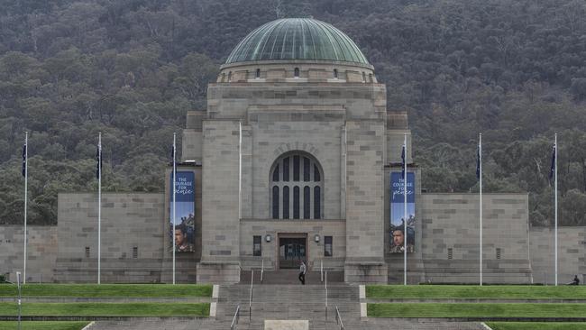 Canberra Closures. A lone security guard patrols around the empty grounds of the Australian War Memorial after they closed the doors to the public. Picture Gary Ramage