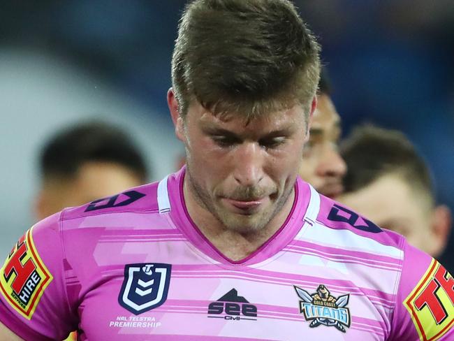 GOLD COAST, AUSTRALIA - AUGUST 16: Jai Arrow and the Titans leave the field during the round 22 NRL match between the Gold Coast Titans and the Parramatta Eels at Cbus Super Stadium on August 16, 2019 in Gold Coast, Australia. (Photo by Chris Hyde/Getty Images)