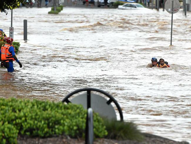 Emergency Service rescue a man from the centre of town in Lismore after heavy flooding in town. Picture: Marc Stapelberg