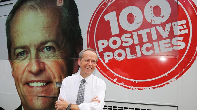 Federal Government Opposition Leader Bill Shorten proudly stands in front of his Labor Party branded bus. Picture: Brendan Radke