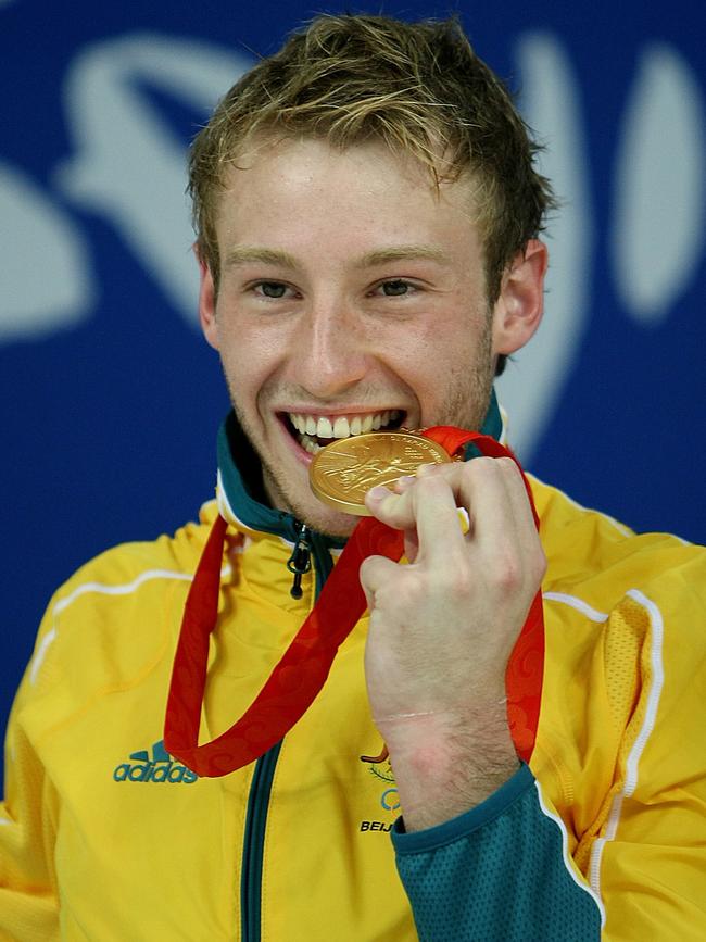 Matthew Mitcham with his 2008 Beijing Olympics gold medal. Picture: AFP