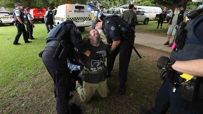 Police detain a protester. Picture: NCA/Gary Ramage