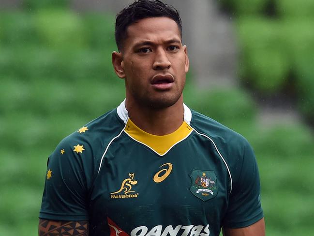 (FILES) In this file photo taken on June 17, 2016, Australian Wallabies player Israel Folau attends the captain's run at AAMI Park in Melbourne. Wallabies star Israel Folau was facing a backlash on April 5, 2018 after the devout Christian said gay people were destined to go to hell. / AFP PHOTO / SAEED KHAN / IMAGE RESTRICTED TO EDITORIAL USE - STRICTLY NO COMMERCIAL USE