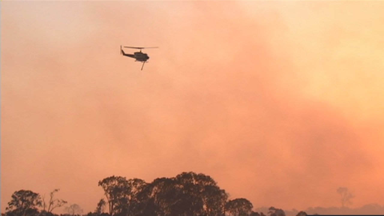 Helicopter pilot survives crash into Qld dam