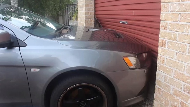 The parked car was pushed into the garage. Picture: supplied