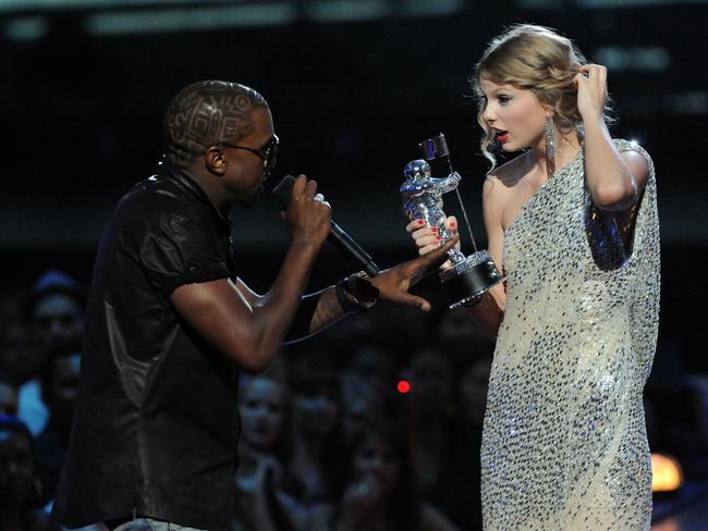 Kayne West jumps on stage as Taylor Swift accepts her award for the "Best Female Video" award during the 2009 MTV Video Music Awards at Radio City Music Hall on September 13, 2009 in New York City. Picture: Jeff Kravitz/FilmMagic