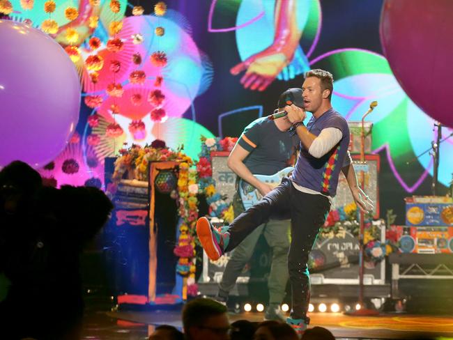 Chart race ... Could Coldplay knock Adele off the top of the charts when they release their new album on December 4? Picture: Matt Sayles / Invision / AP